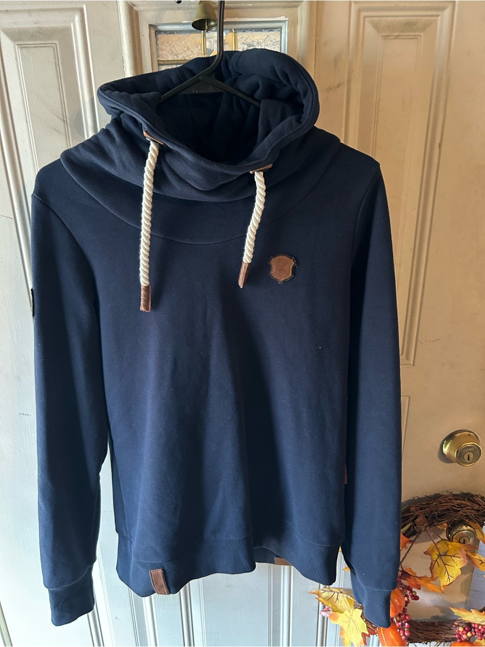 Naketano navy blue hoodie with rope on hood.